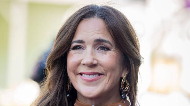 Queen Mary, 54, is effortlessly elegant in waist-cinching polka-dot dress