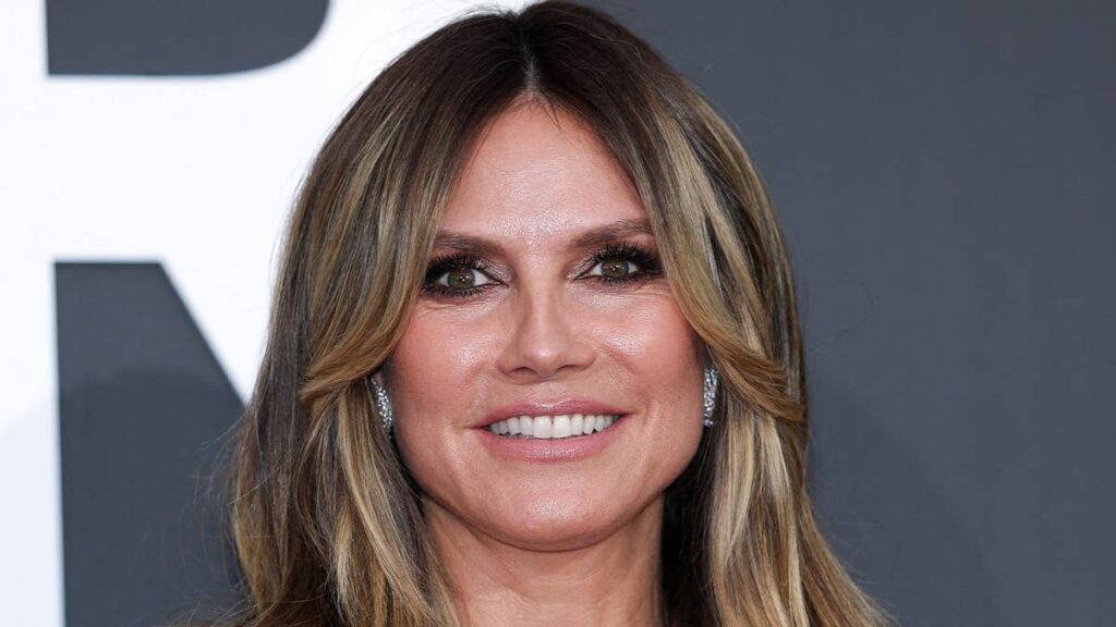Heidi Klum, 53, turns heads in a plunging pink corset and lace blouse