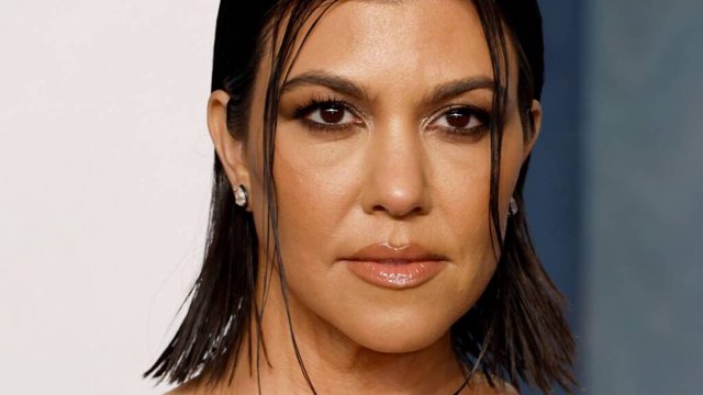 Kourtney Kardashian accentuates her flawless curves in lacy naked dress