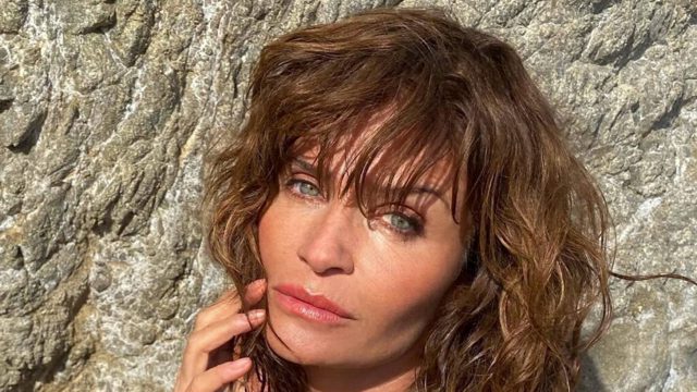 ’90s supermodel Helena Christensen, 57, stuns in plunging lace ‘naked’ dress at London Fashion Week