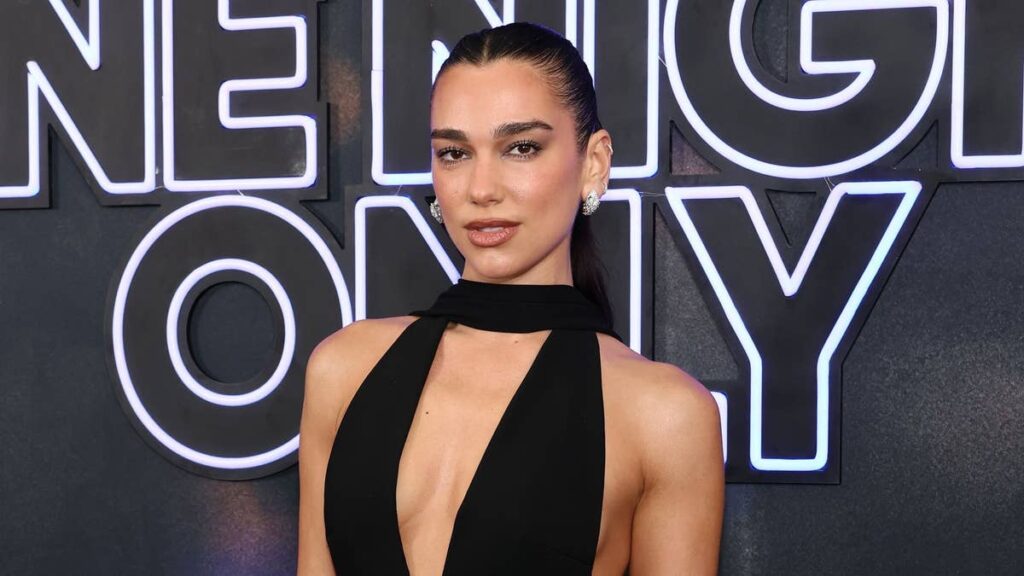 Dua Lipa perfects transitional dressing in daring sheer top