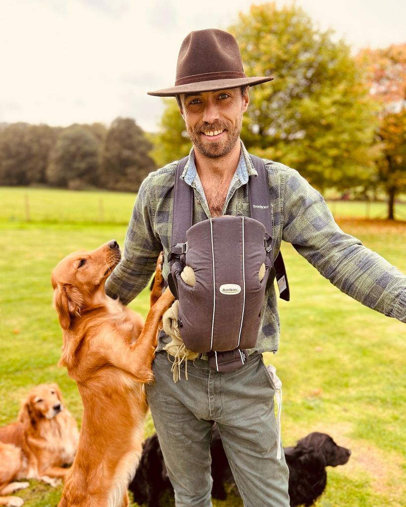 James Middleton with baby Inigo in carrier