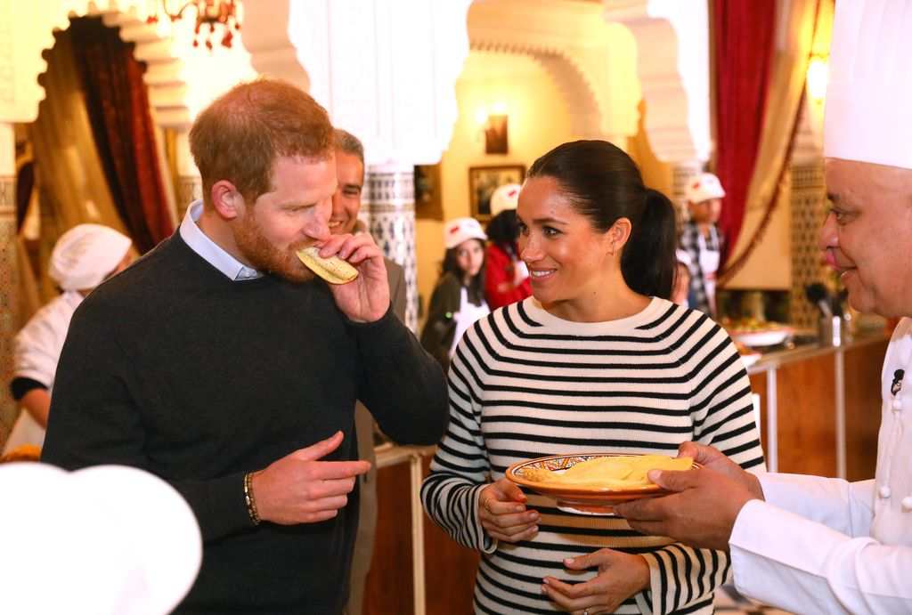 Prince Harry and Meghan eating