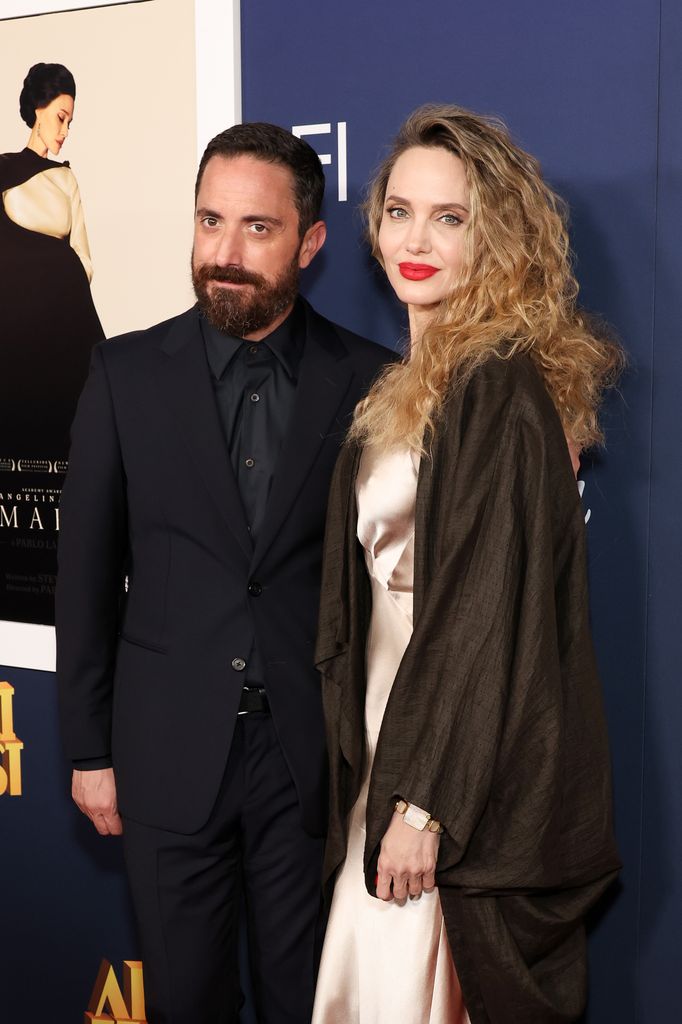 two people posing on red carpet