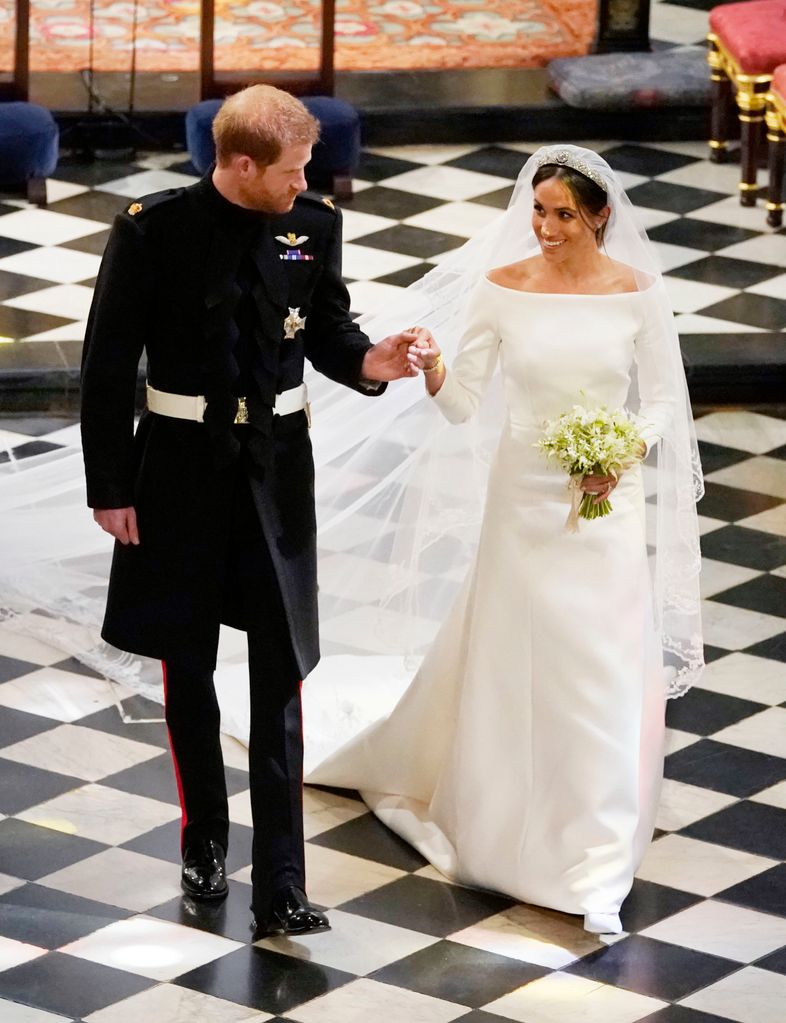 Prince Harry, Duke of Sussex and The Duchess of Sussex depart following their wedding in St George's Chapel at Windsor Castle on May 19, 2018 in Windsor, England. (Photo by Owen Humphries - WPA Pool/Getty Images)