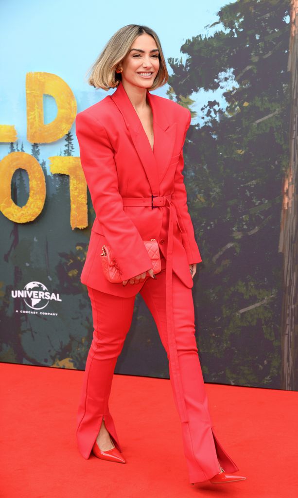  Frankie Bridge wears a red suit as she attends "The Wild Robot" Headline Gala during the 68th BFI London Film Festival at The Royal Festival Hall on October 13, 2024 in London, England.