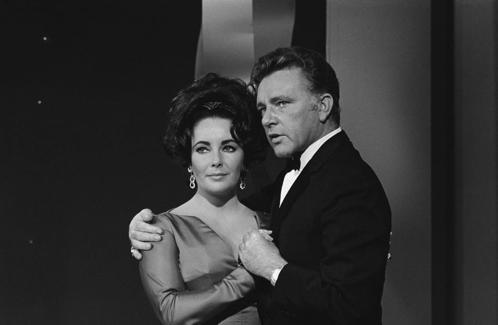 Elizabeth Taylor and Richard Burton embracing