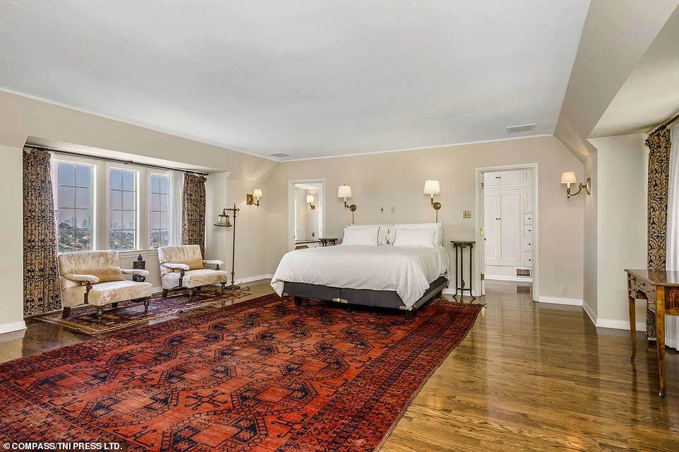 The master bedroom includes a valuable view of the Los Feliz hills straight into the skyline of downtown Los Angeles