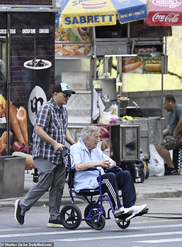 A caretaker pushes Bennett to Central Park for an afternoon