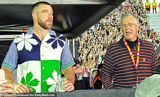 Watching it go down: Travis and Scott cheered Taylor on from a VIP tent that night as she played a date of her Eras Tour at the Estadio River Plate in Buenos Aires