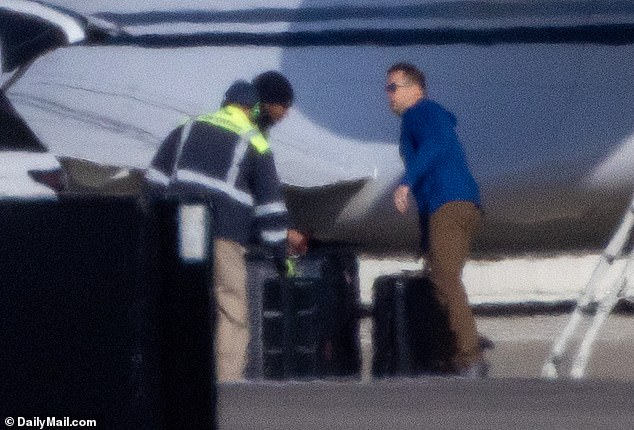 Handlers were seen loading her bags on the plane, despite her plans to stay in Kansas City for the next few weeks