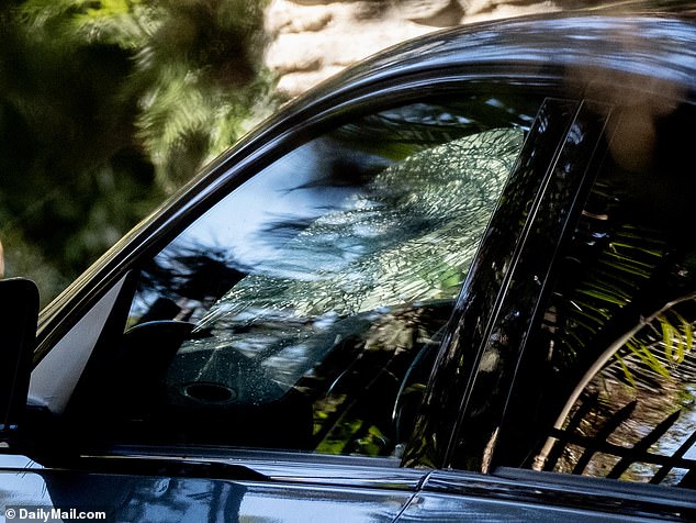 The cracked windshield can be seen from the side angle of the car on the  drivers side