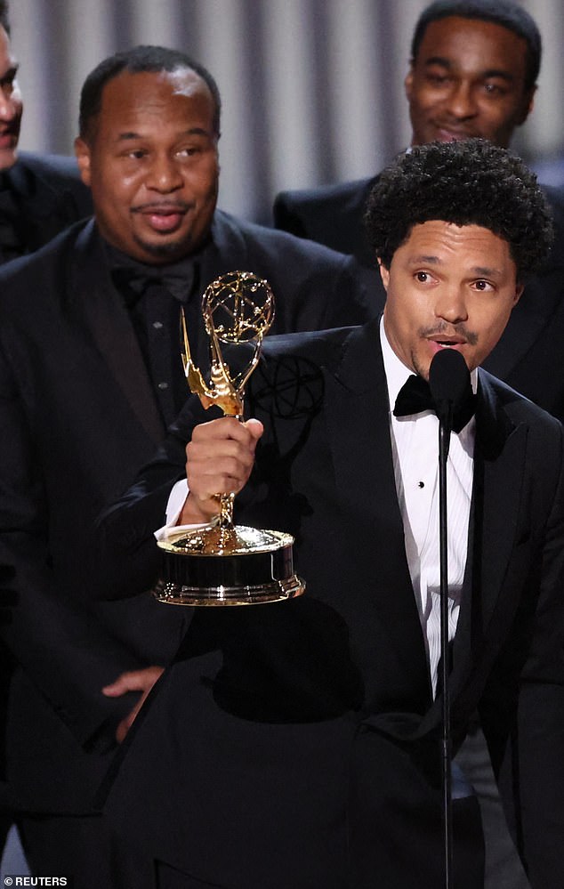 Roy Wood Jr (left) made sure to mouth his message while the cameras were on him