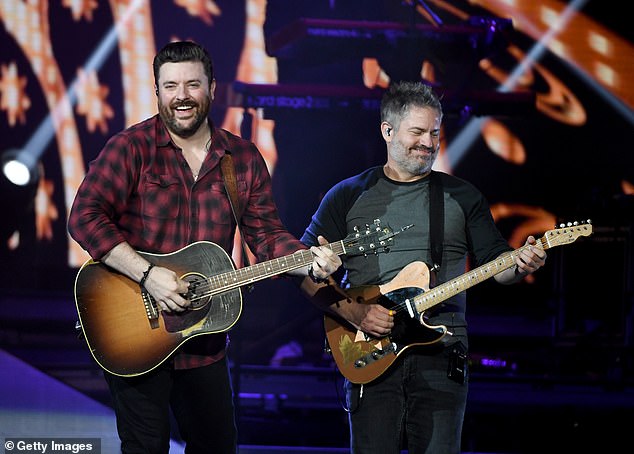 'In light of the video evidence, Tennessee ABC needs to drop the charges and apologize for the physical, emotional and professional harm done towards my client'; Young (L) and guitarist Kevin Collier seen in 2019