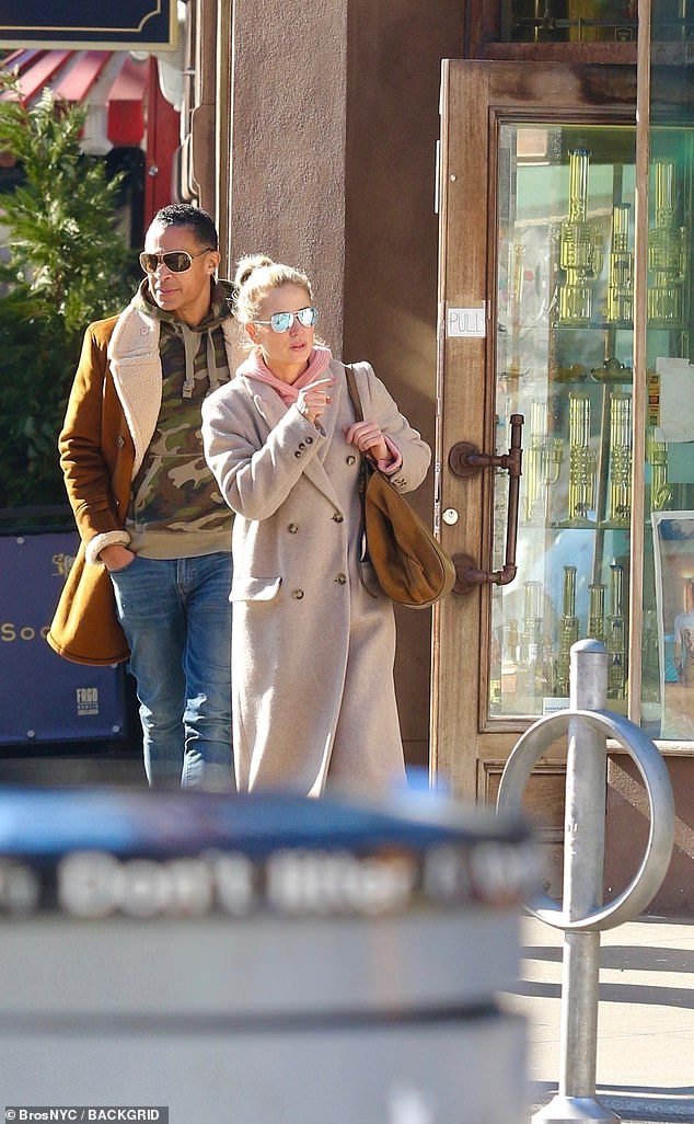 The celebrity couple wrapped in matching outfits of hoodies and warm jackets for their outing in downtown Manhattan