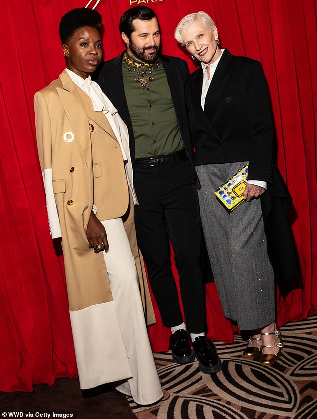 Maye and Gherardo gathered together to have their picture taken in front of the backdrop with Bob Hearts Abishola star Folake Olowofoyeku