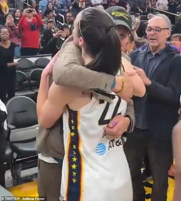 Clark and Kutcher embraced in celebration after Clark won her first ever WNBA game