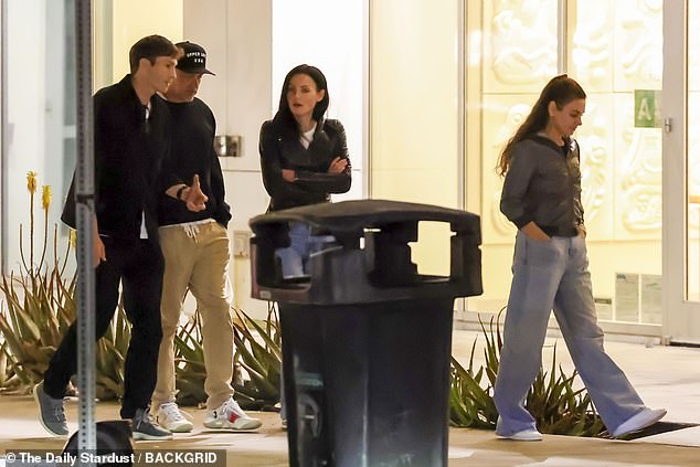 They were dressed casually for the outing as they walked side by side to a parking lot with another couple