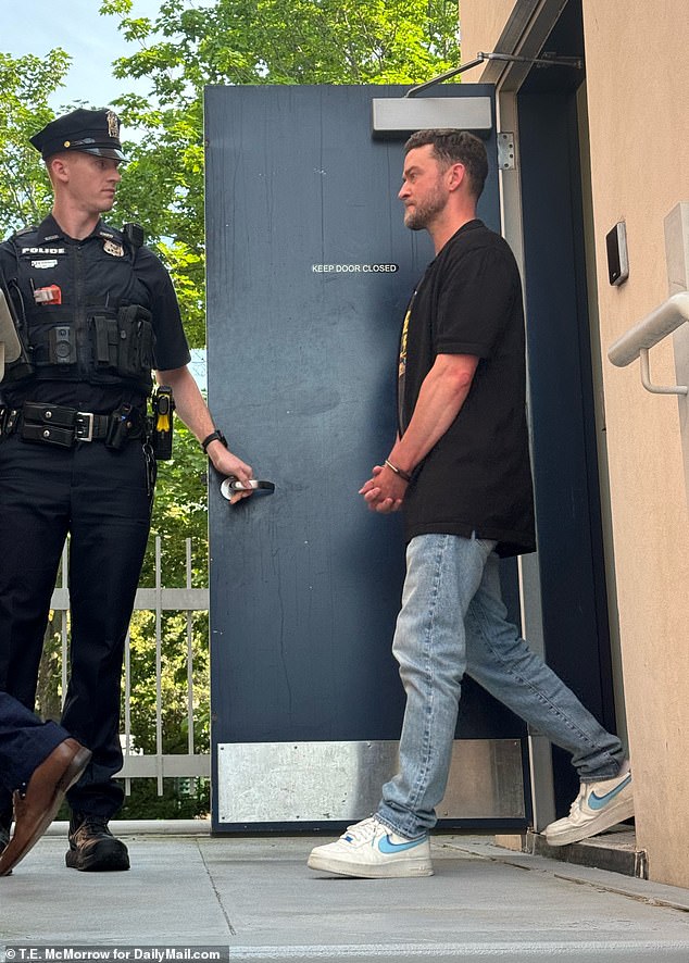 Timberlake was spotted being walked across the bridge from Sag Harbor police headquarters to the villages Justice Court while in handcuffs Tuesday morning