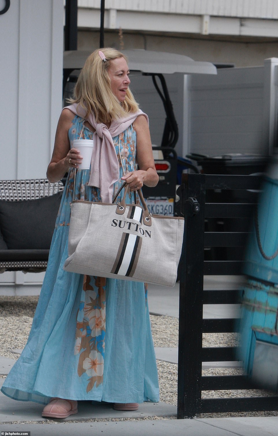 Sutton's overnight bag was hard to miss as it had her name emblazoned on it!