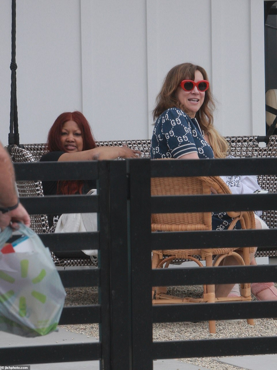 Garcelle and Sutton sat in their pajamas on the porch swing while Jennifer sat beside them in a Gucci dress and sneakers