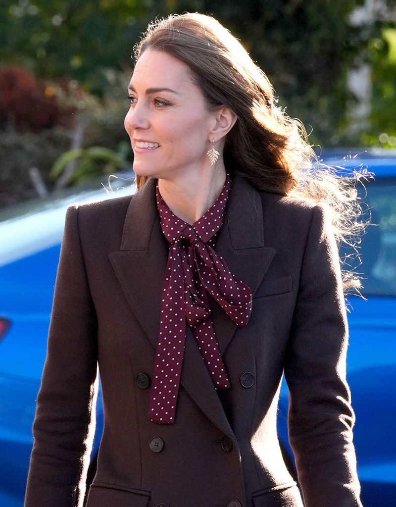 The Princess of Wales in brown coat with gold fern earrings