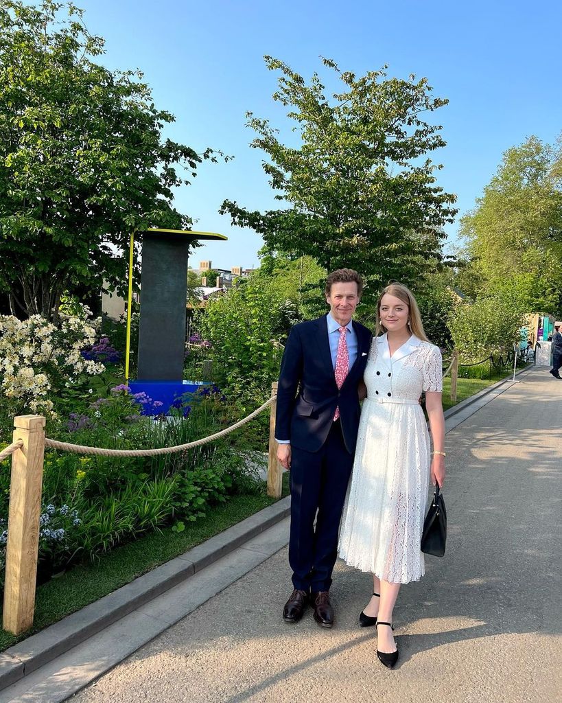 Flora Vesterberg in a white lace dress with her husband