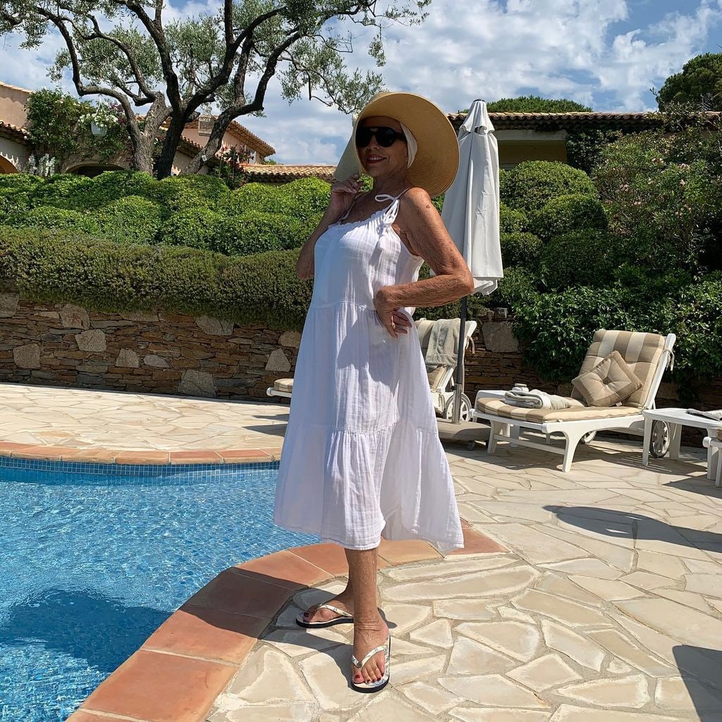 woman standing by swimming pool