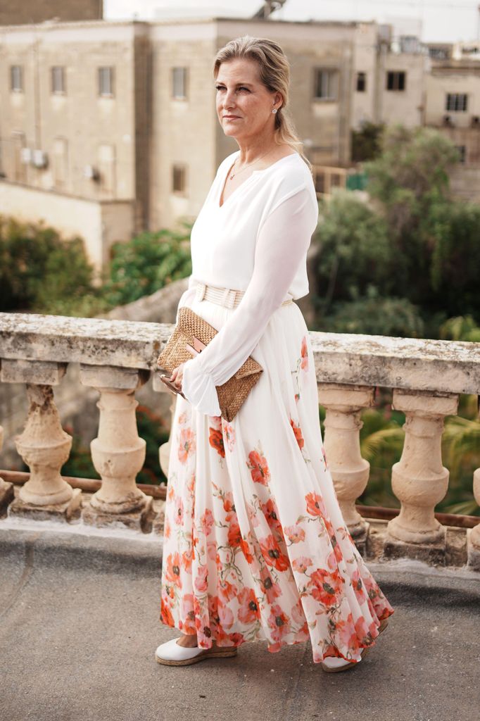 The Duchess of Edinburgh in white blouse and white skirt with poppies on