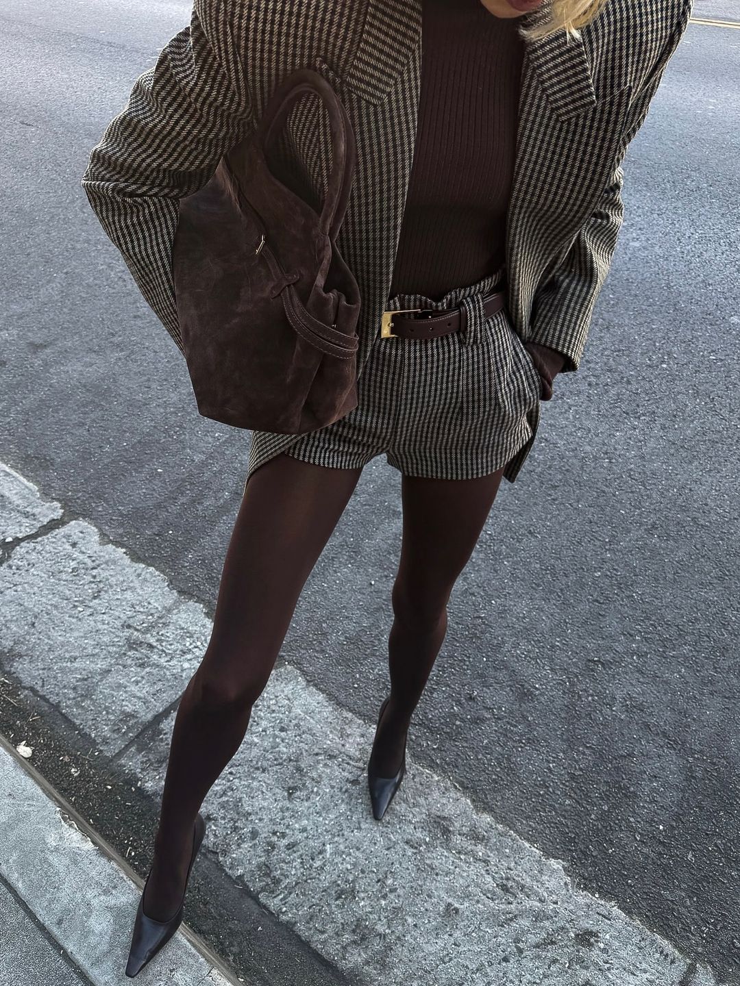 Elsa Hosk poses in brown tights and a matching short and jacket combo on her Instagram