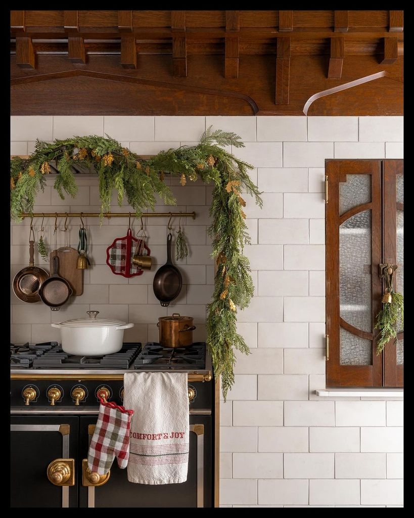 Kitchen oven decorated with green garland 