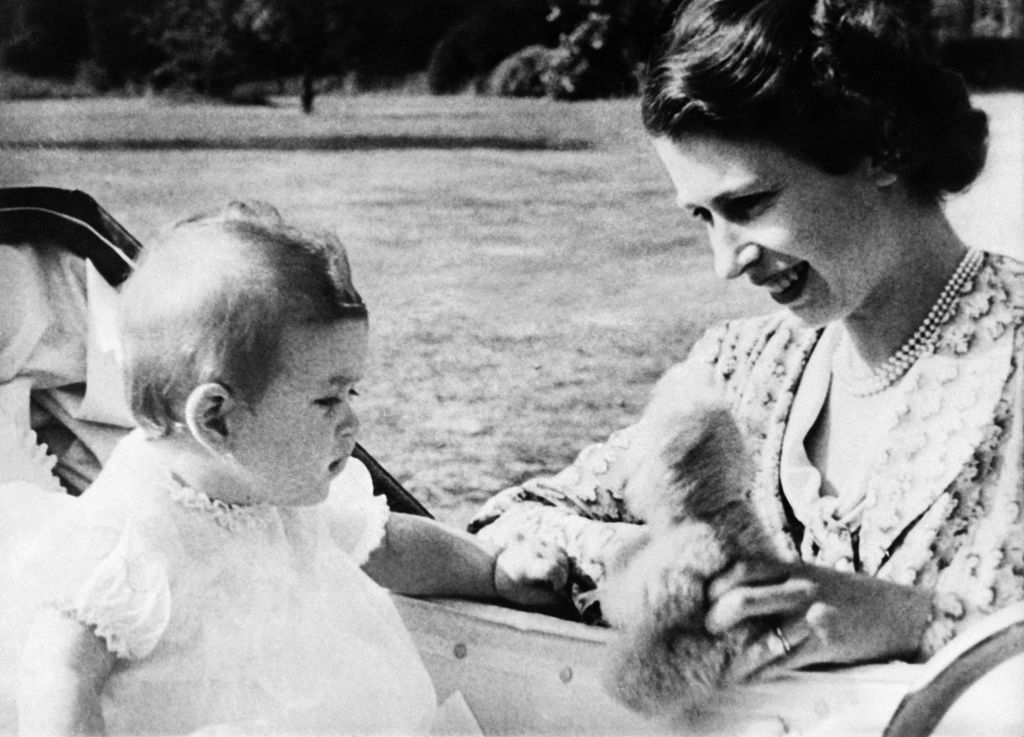 Elizabeth showing baby Charles a teddy bear in 1949