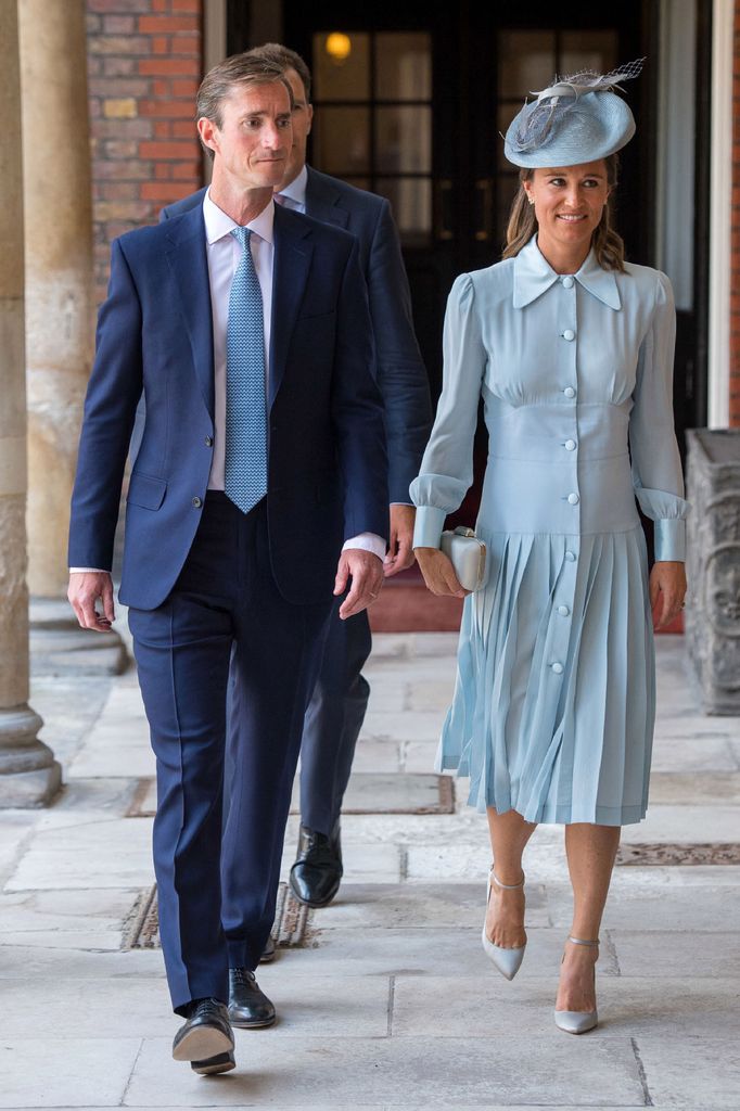 Pippa Middleton in a pale blue dress with james matthews at christening