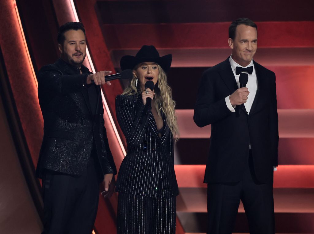 Luke Bryan, Lainey Wilson and Peyton Manning speak onstage during The 58th Annual CMA Awards at Bridgestone Arena on November 20, 2024 in Nashville, Tennessee