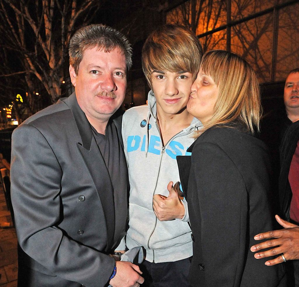 Liam with his parents Geoff and Karen in 2010