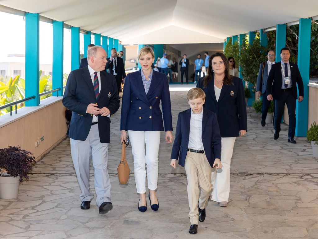 Prince Albert, Princess Charlene and Prince Jacques in pale trousers and dark jackets