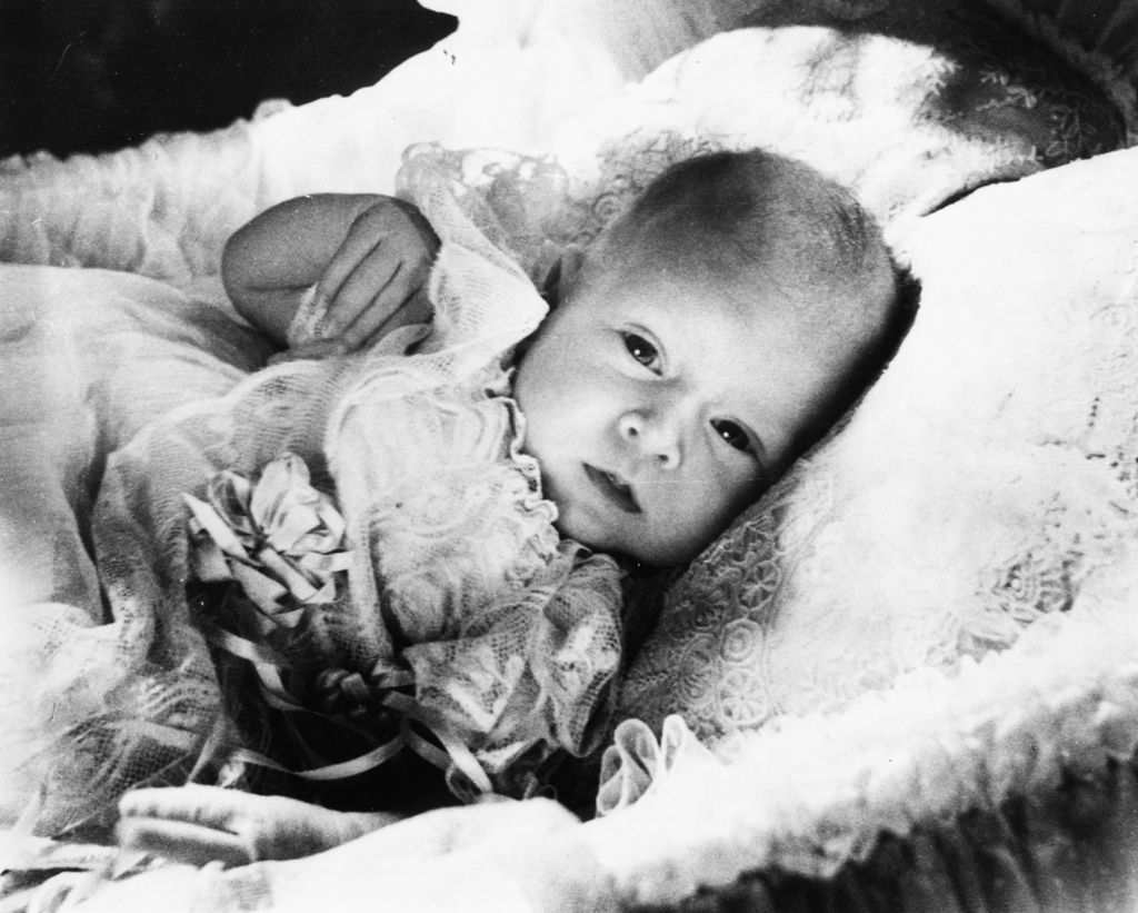 A childhood portrait of the baby King Charles in his basket at Buckingham Palace