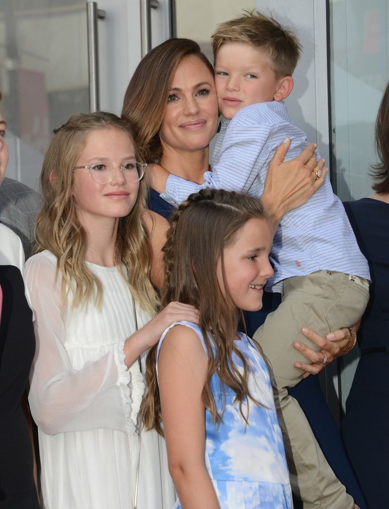 Jennifer Garner poses with children Violet Affleck, Samuel Garner-Affleck and Seraphina Rose Elizabeth Affleck during the ceremony honoring her with a star on the Hollywood Walk Of Fame