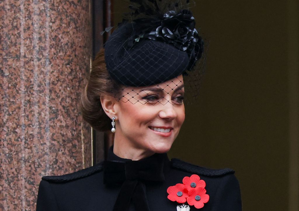 Kate Middleton looks on from a balcony