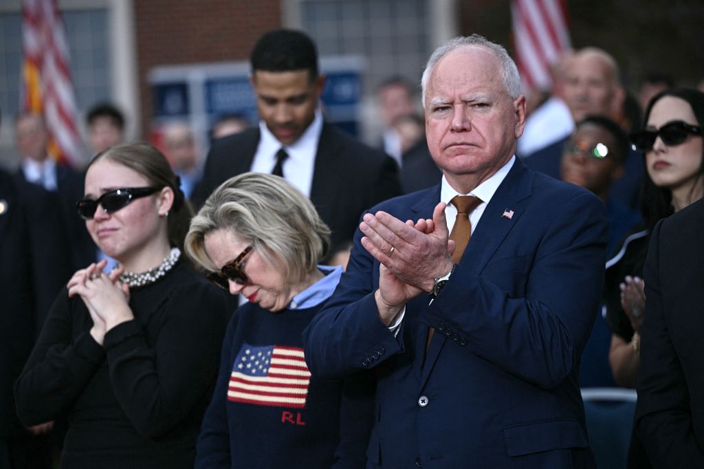 Minnesota Governor and Democratic vice presidential candidate Tim Walz (L) and his wife Gwen Walz react during US Vice President Democratic presidential candidate Kamala Harris speech