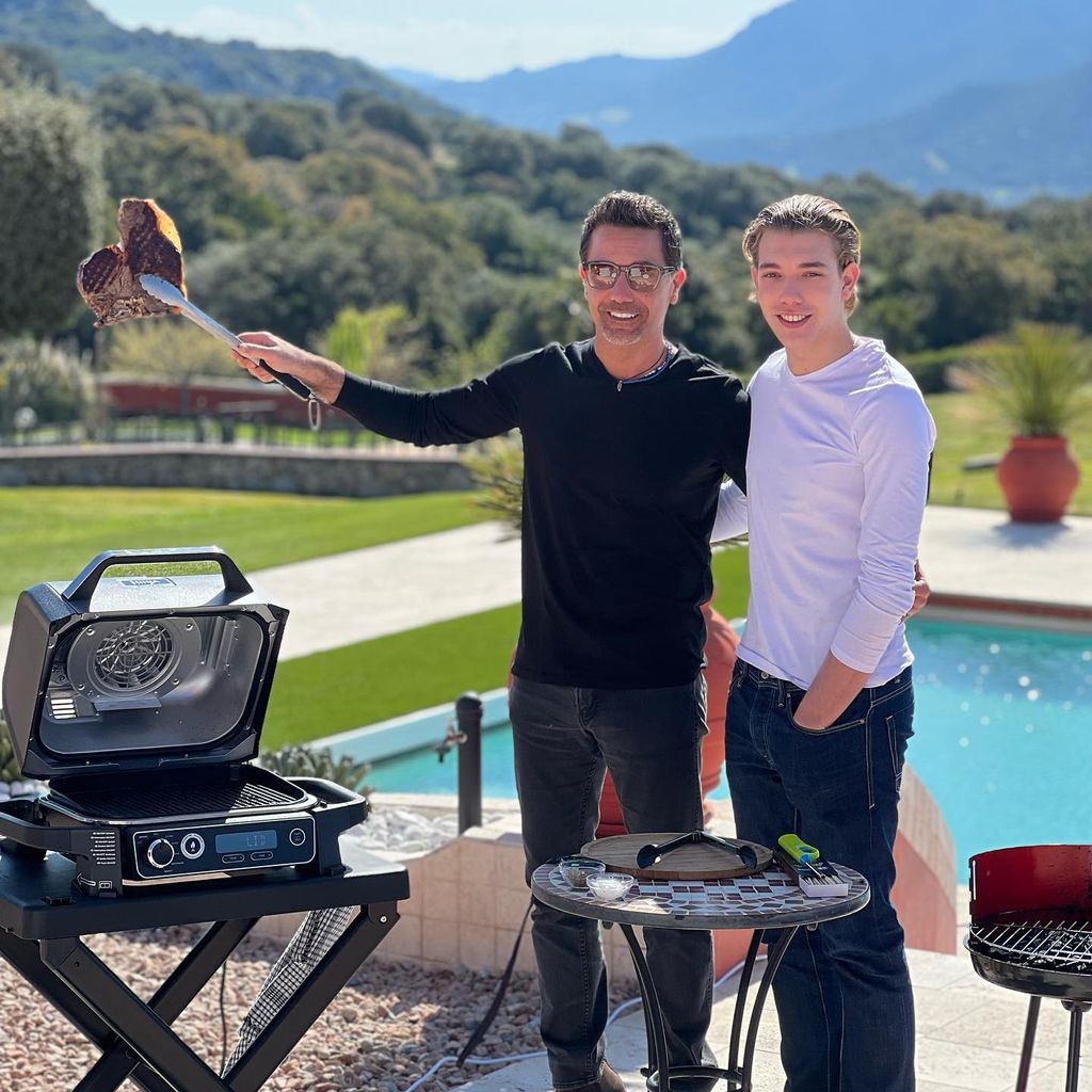 gino outside smiling with son rocco 