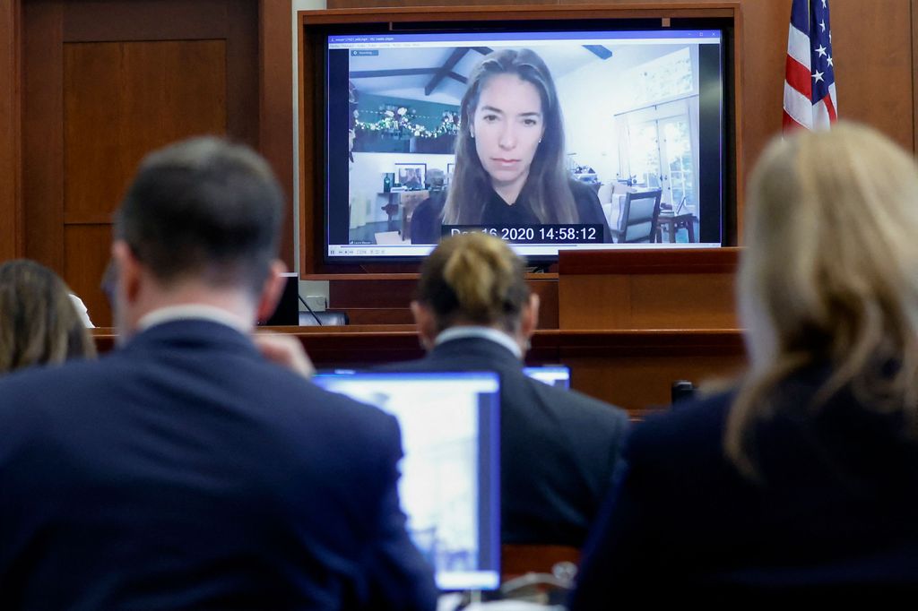 Johnny Depp watches a pre-recorded deposition testimony of Laura Wasser during Depp's defamation trial against his ex-wife Amber Heard, at the Fairfax County Circuit Courthouse in Fairfax, Virginia, April 27, 2022