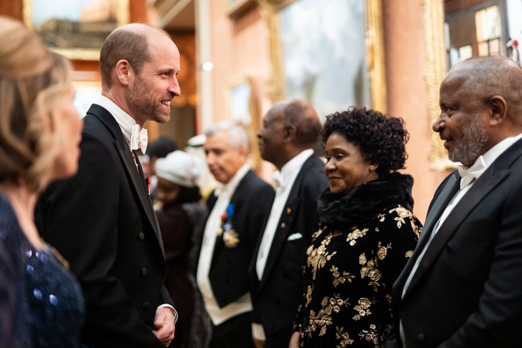 Prince William speaking with guests