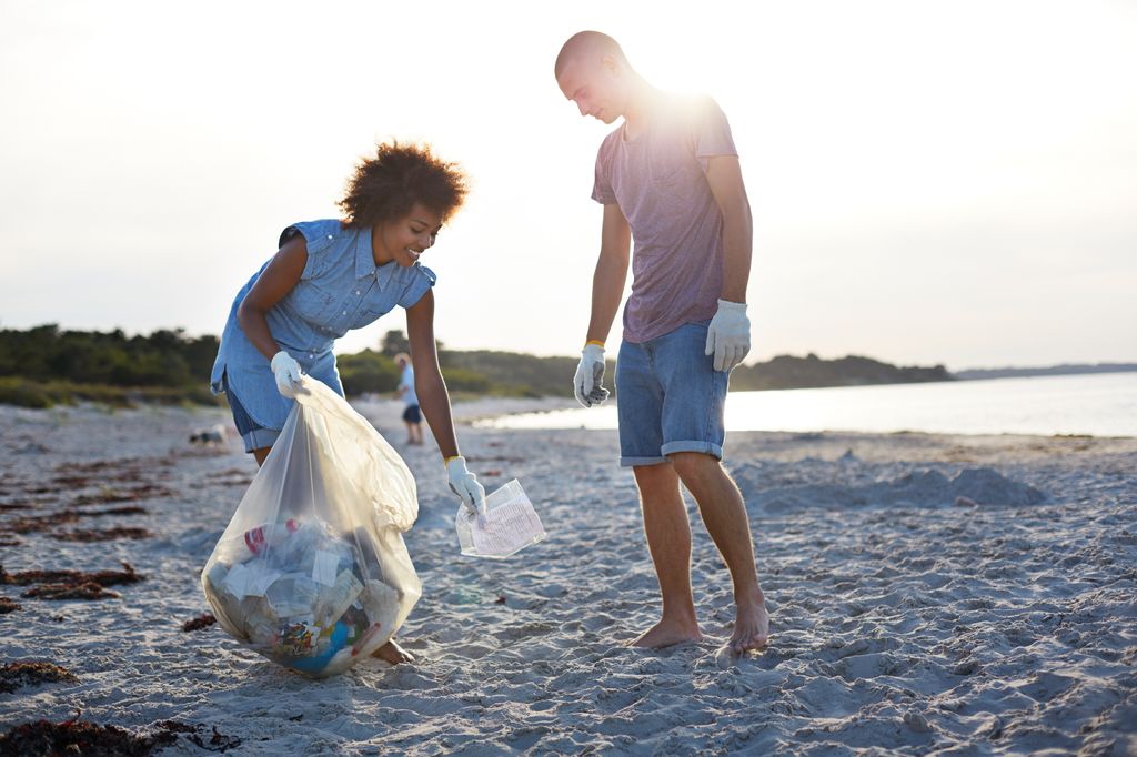 Teenagers doing beach clean