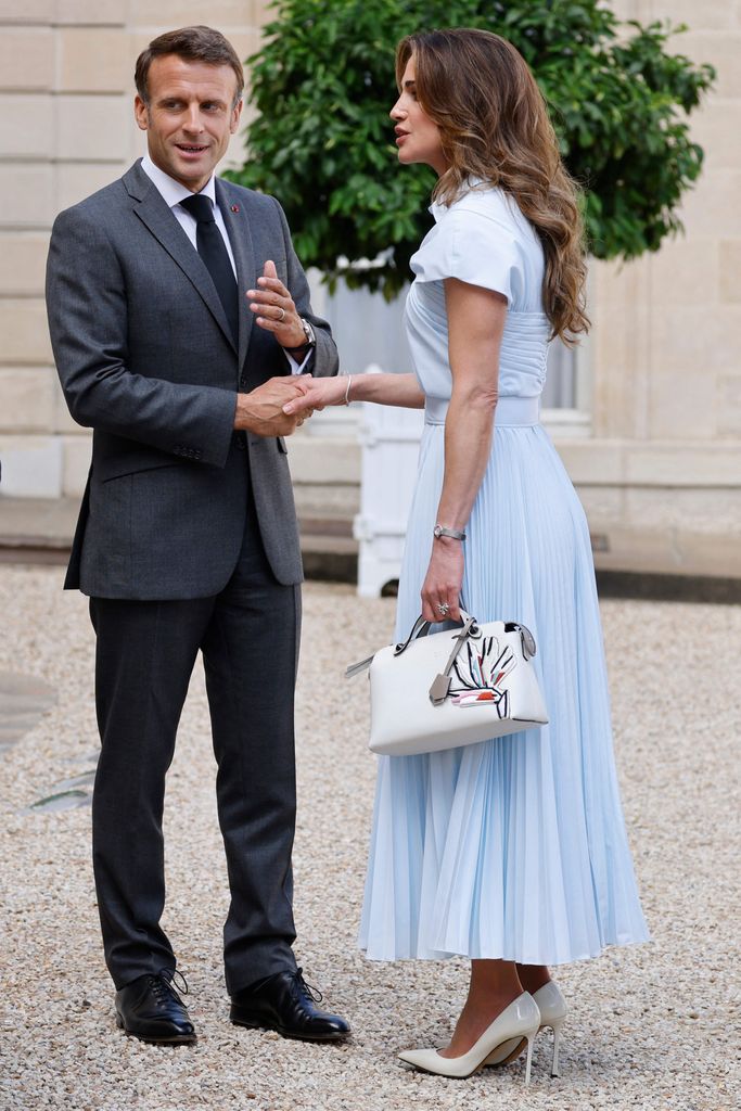 Queen Rania shaking emmanuel macron's hand