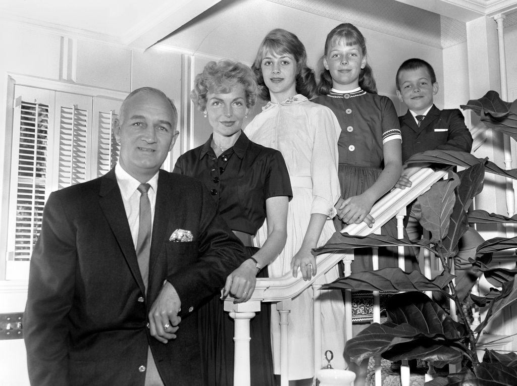 Tom Harmon, retired professional football player, a KNX / CBS sportscaster. At home with family. April 12, 1960. Los Angeles, CA. From left is Tom Harmon; his wife, Elyse Knox; daughter, Kristin Harmon (age 14), daughter Kelly Harmon (age 11); son, Mark Harmon (age 8), who later becomes a notable actor