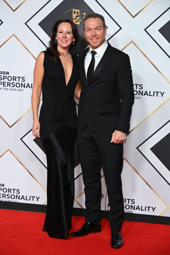 couple posing on red carpet