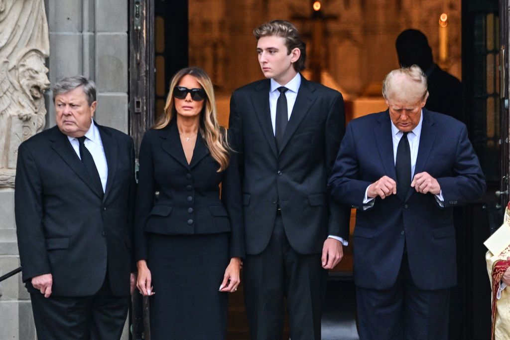 Former US President Donald Trump (R) stands with his wife Melania Trump (2L) their son Barron Trump (C) and father-in-law Viktor Knavs, at the start of a funeral for Amalija Knavs, the former first lady's mother, outside the Church of Bethesda-by-the-Sea, in Palm Beach, Florida, on January 18, 2024