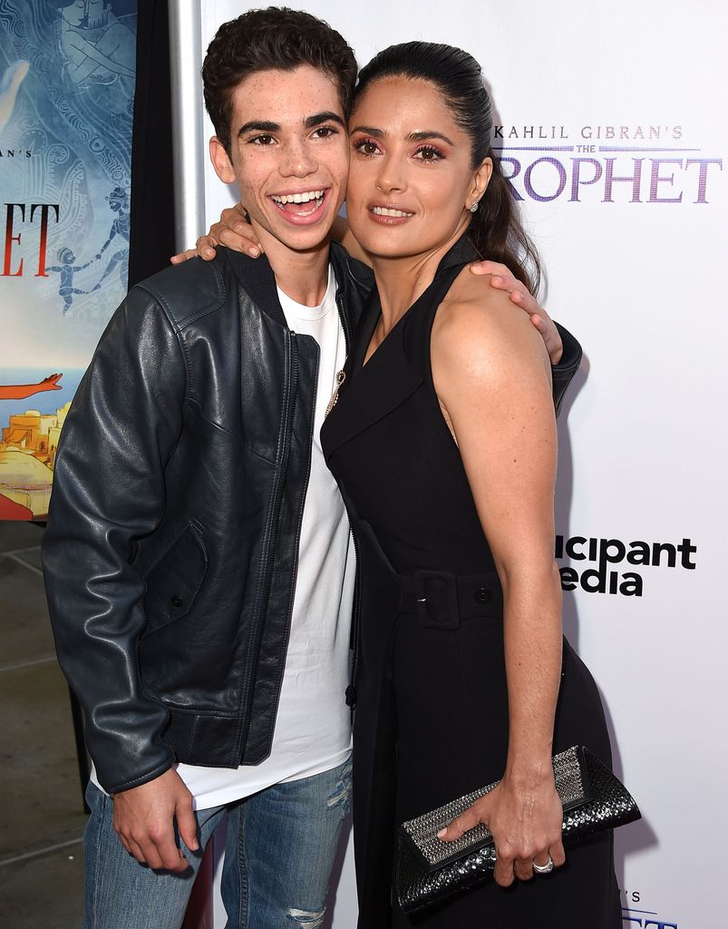 Salma Hayek and Cameron Boyce embracing each other