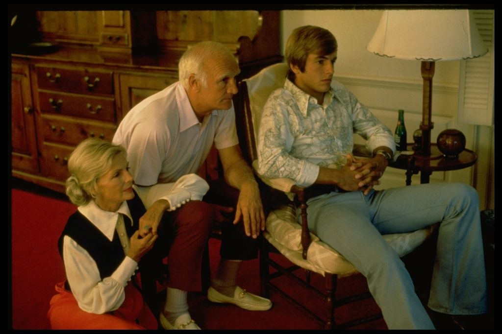 Former Michigan football superstar Tom Harmon (C) w. wife Elyse Knox Harmon & son Mark, U.C.L.A.'s quarterback, watching reruns of Mark's football game